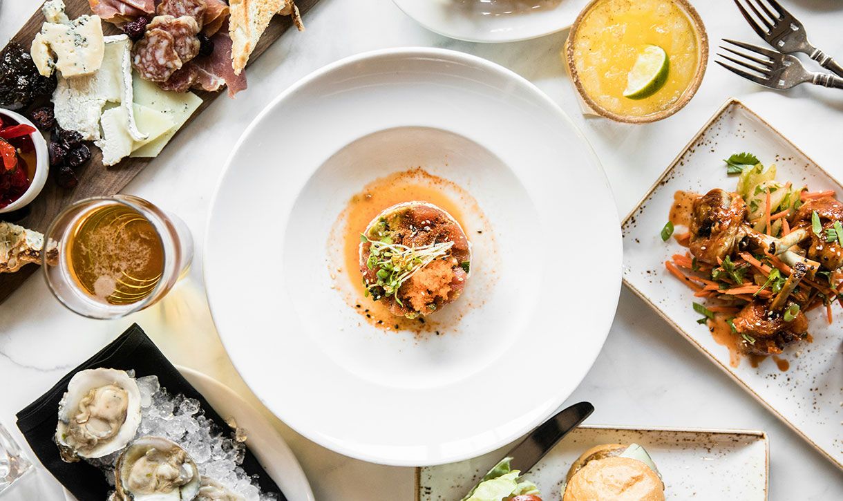 A variety of seafood on plates photographed from overhead